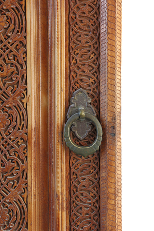 part of the old wooden door with round door handle, courtyard of the Barak Khan Madrassah, Complex Khazrat (Hast) Imam, Tashkent, Uzbekistanの写真素材
