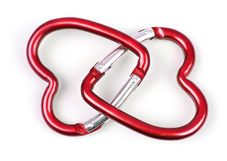 two connected heart-shaped carabiner, red colorの写真素材