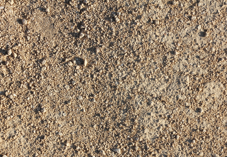 part of dirt road of small gravel and sand, closeup, textureの写真素材