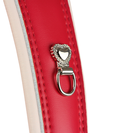 silver heart with ring on the pink leather strap, part of leather bagの写真素材