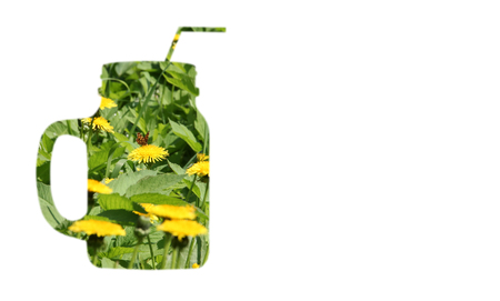 photo collage of field of blooming herbs dandelions with butterfly through the shape of a smoothie mug, isolated background, healthy vegan raw lifestyle, copy spaceの写真素材