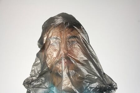 black plastic bag, gray background, concept of big ecology problem, copy spaceの写真素材