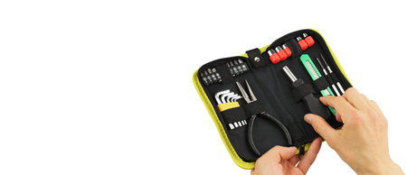 portable or pocket toolkit with set locksmith tools for home in man hands, pliers, hexagon keys,...