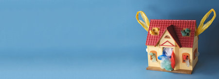 Plastic house with handles and colored used plastic bags garbage insideの写真素材