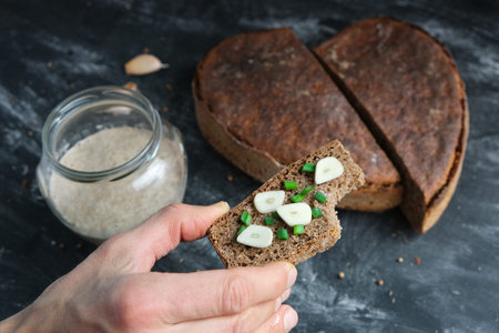 Hand hold bitten sandwich artisan breadの写真素材