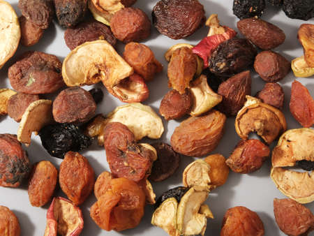 compote mixture of dried fruits, dirty natural organic dried apples, raisins with apricots, uruk and prunes, closeup top viewの写真素材
