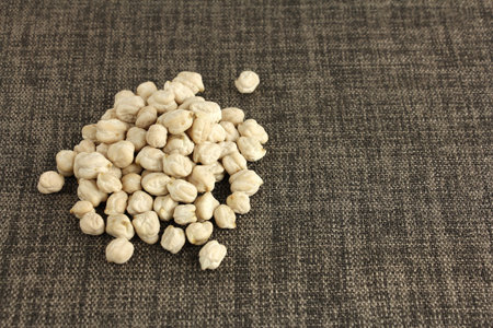 dried chickpeas on cloth, ingredient for hummus, chickpea are best vegetable protein for vegan or vegetarian, copy spaceの写真素材