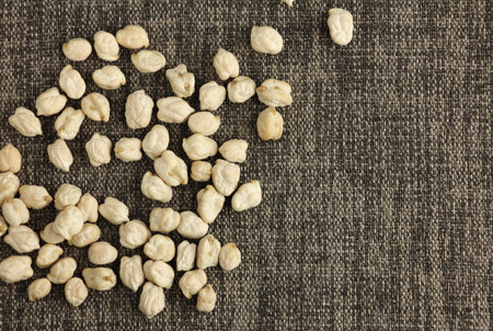 heap of dried chickpeas on cloth, ingredient for hummus, chickpea are high in vegetable protein for vegan or vegetarianの写真素材