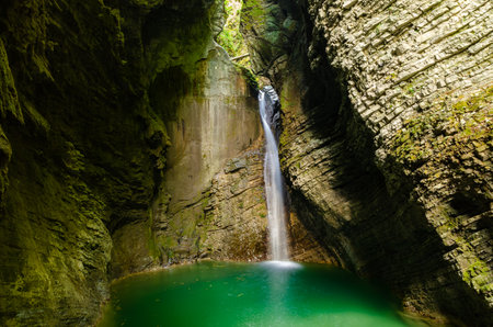 Waterfall Kozjak inside of a cave in Slovenia - Dolina Soce. Soca riverの写真素材