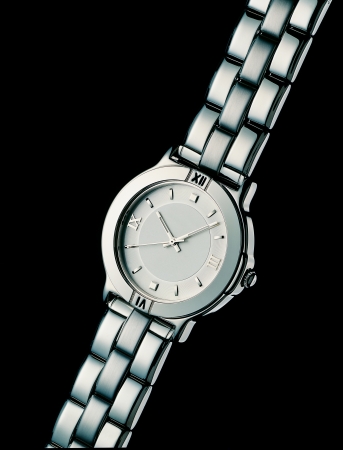 Luxury Silver Watch over a Black Backgroundの写真素材