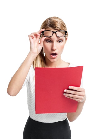 Pretty Secretary Surprised Looking to a Red Folder Isolated on Whiteの写真素材