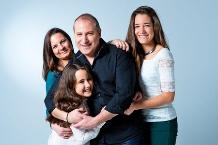 Happy Family Over a Light Blue Background