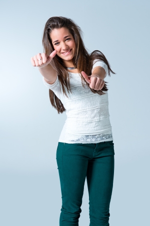 Beautiful Teenager with a Positive Expression doing the OK Signの写真素材