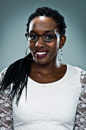 Young Happy Black Woman Over a Grey Backgroundの写真素材