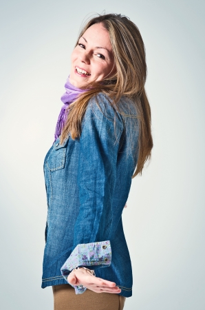 Happy Young Girl Over a Grey Backgroundの写真素材