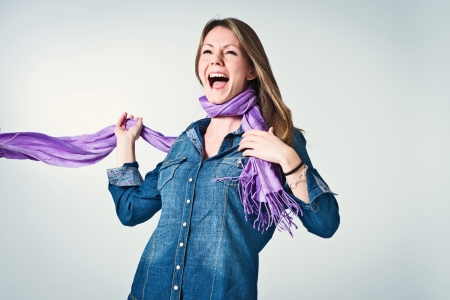 Happy Young Girl Over a Grey Backgroundの写真素材