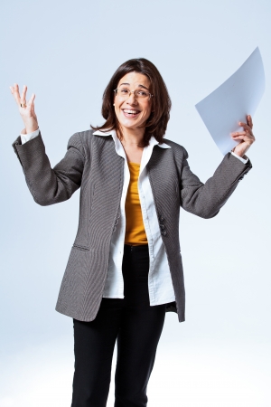 Happy Confident Business Woman over a Grey Backgroundの写真素材