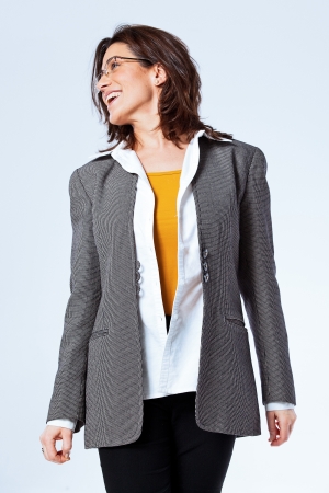 Happy Confident Business Woman over a Grey Backgroundの写真素材