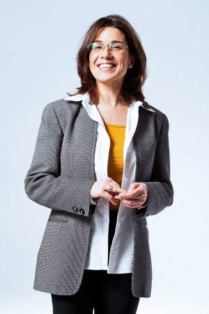 Happy Confident Business Woman over a Grey Backgroundの写真素材