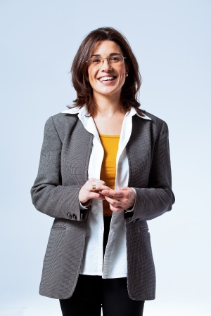 Happy Confident Business Woman over a Grey Backgroundの写真素材