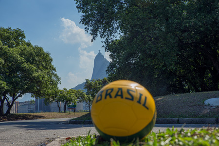 Football on the street in front of Christ Statue Silhouette, Rio de Janeiro, Brazilの写真素材