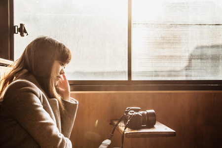 Chinese girl sitting in a trainの写真素材