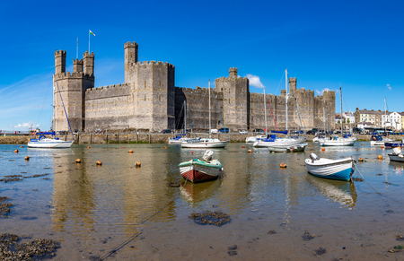 Caernar fon Gwynedd Wales May 12, 2019 Caernarfon castle, on the estuary of the river Seiont where it enters the Menai Straitのeditorial素材