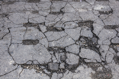 damaged cracked asphalt pattern textureの写真素材