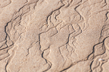 closeup of sand pattern of a beach in the summer thailandの写真素材