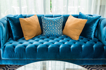 row of pillows on sofa in living roomの写真素材