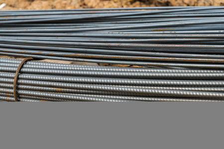 Steel rods or bars used to reinforce concrete in constructionの写真素材
