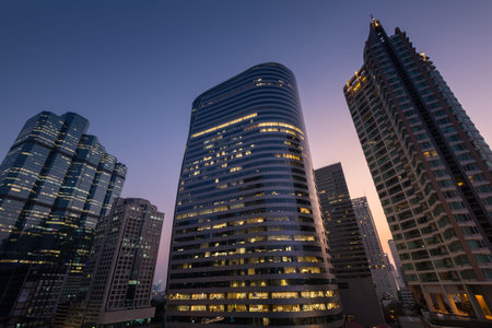 Perspective and underside angle view of Modern skyscrapers at dusk.