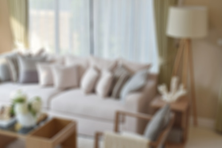 blur image of modern living room with sofa and lamp at homeの写真素材