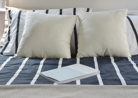 A book on striped bedding modern styleの写真素材