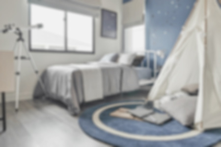 blur image of adventure style decoration with deep blue color in modern bedroom interiorの写真素材