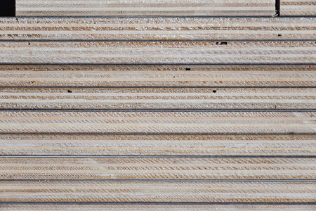 Stack of industrial plywood in construction site for backgroundの写真素材