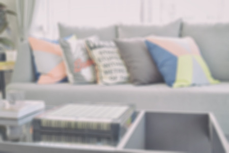 blurred modern living room design with colorful pillows on sofa for backgroundの写真素材