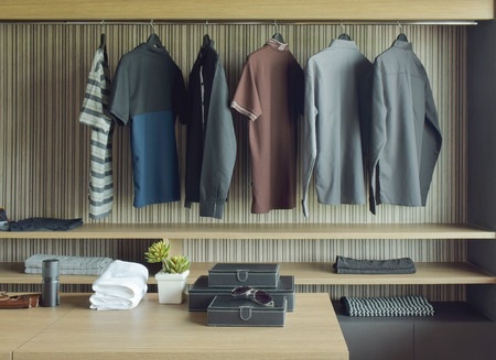 Men cloths in wooden walk in closetの写真素材
