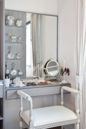 vintage style dressing room with classic white chair and dressing tableの写真素材
