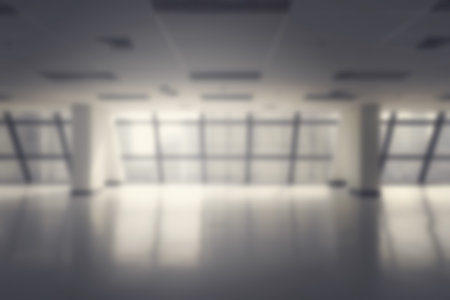 blurred empty office space in high rise building for background