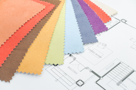 Colorful fabric sample with an architectural drawing paper on designer deskの写真素材