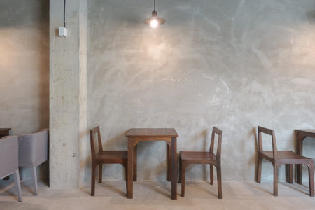 Wooden table and chair in the restaurant with pendant light