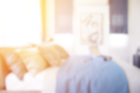 Defocus blue scheme bedroom interior with briefcase on bedの写真素材