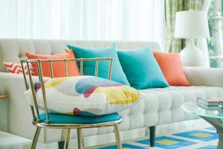 Closeup pillow on vintage chair with sofa in living roomの写真素材