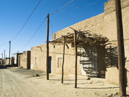 Streetscape in Merzouga -Morocco with its typical buildings out of loam next to the desert Erg Chubbyの写真素材