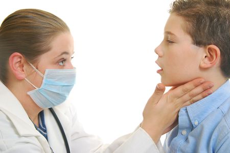 female Doctor examining young boy isolated on white.の写真素材