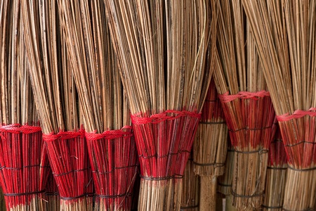 Coconut leaf broom .  A wisdom of villagers made of coconut leaves used in the home.の写真素材