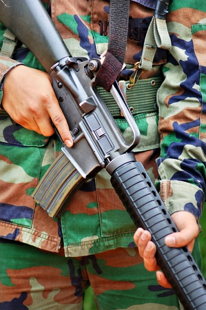 Close-up pictures of soldiers carrying  M 16  in combat training.の写真素材