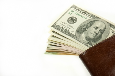 Blown wallet and dollar notes isolated on white background  の写真素材