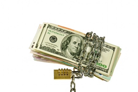 Dollars and other notes  with chain on white backgroundの写真素材